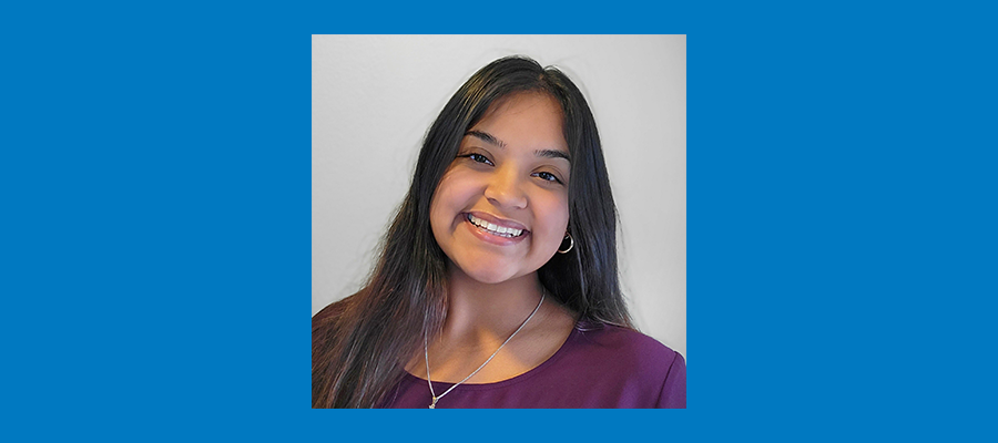 A headshot of Cynthia Flores wearing a plum-colored shirt to accompany her employee spotlight on wildlife conservation to vegetation management.